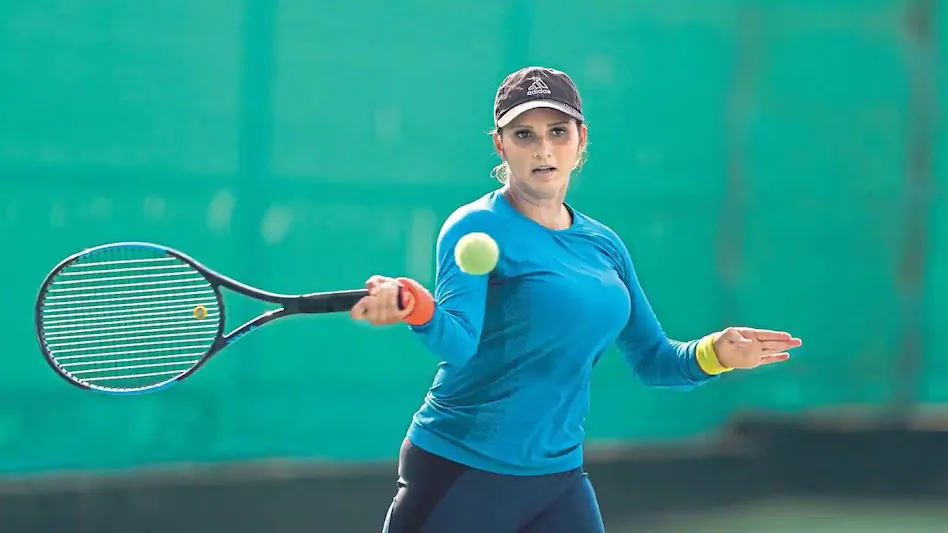 sania mirza with her tennis racket and ball