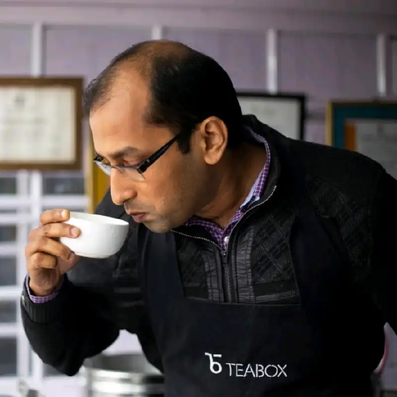 man tasting teabox tea